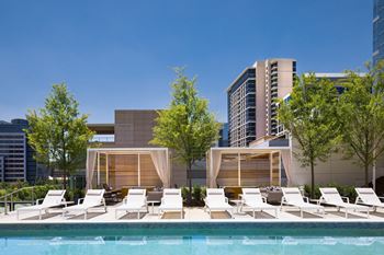 Pool side Kettal loungers and private cabanas